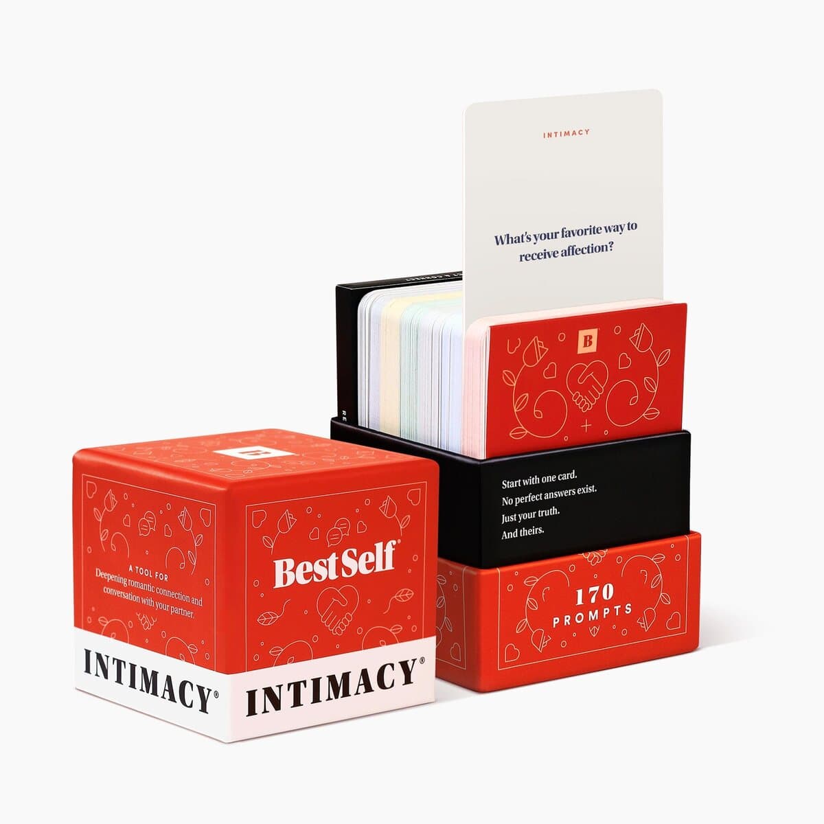 The BestSelf Intimacy Deck box standing beside a fanned spread of its question cards.