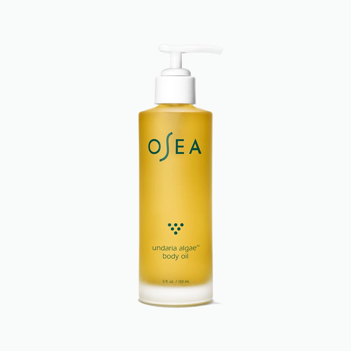 A frosted glass pump bottle of OSEA Undaria Algae Body Oil, the oil inside a deep gold.